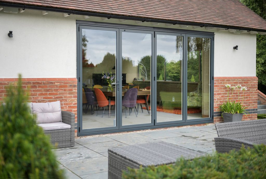 Garden view of home with black bifold doors